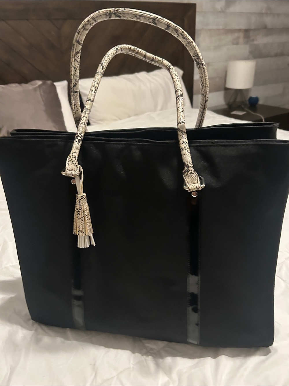 Black Tote with Snake-Print Handles and Tassel Accent